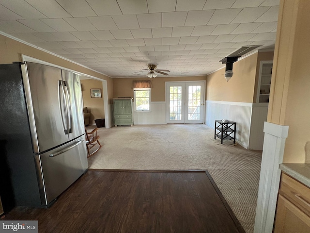 kitchen with ceiling fan, ornamental molding, stainless steel refrigerator, and light wood-type flooring