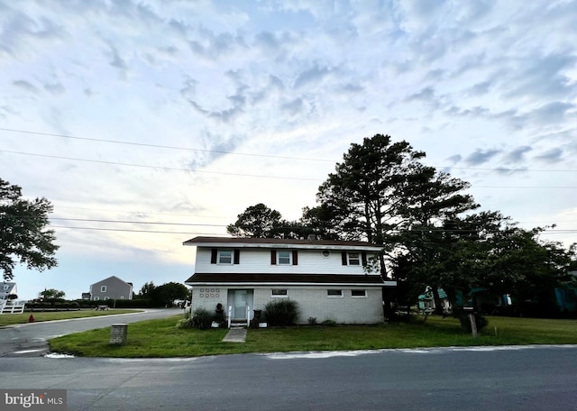 front facade with a front lawn