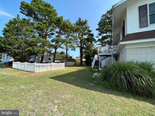 view of yard featuring a wooden deck