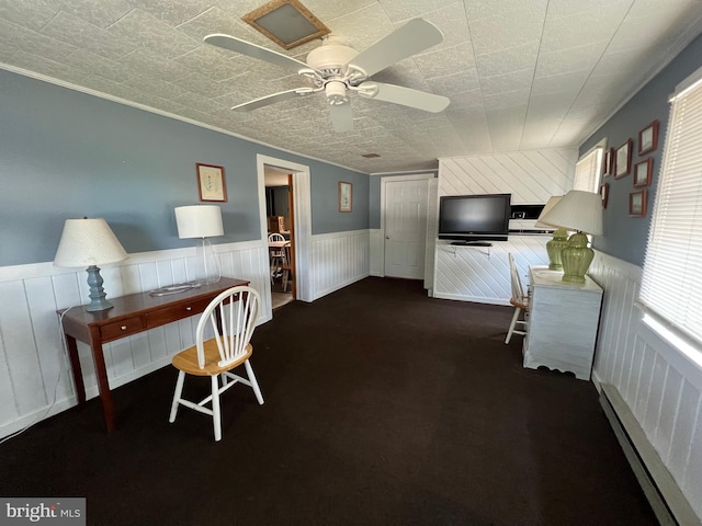 unfurnished dining area with crown molding, ceiling fan, and dark carpet