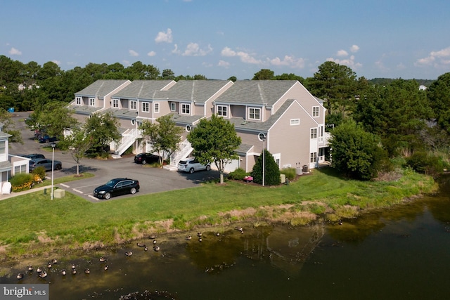 birds eye view of property featuring a water view