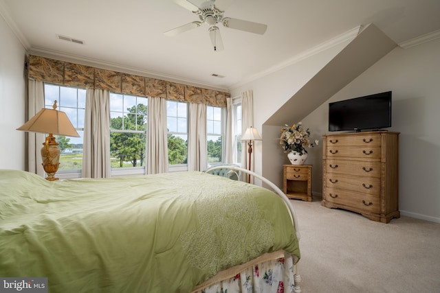 carpeted bedroom with crown molding and ceiling fan