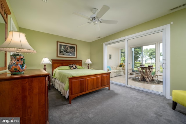 bedroom with ceiling fan, dark carpet, and access to exterior