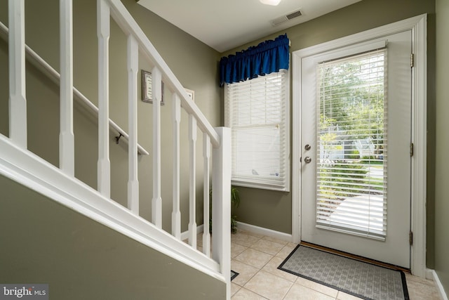 entryway with light tile flooring