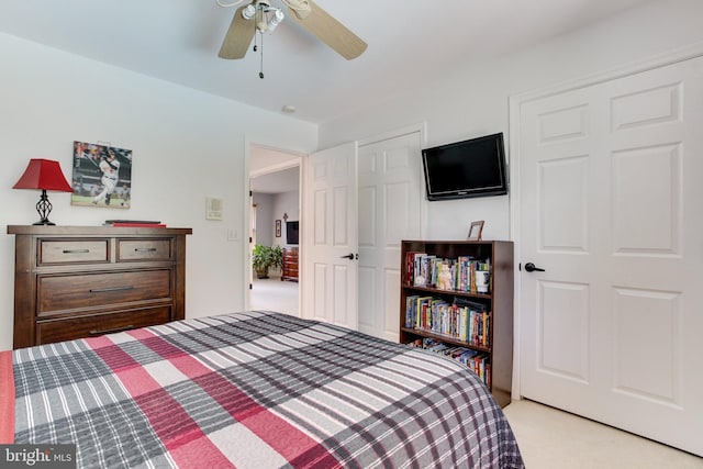 carpeted bedroom with ceiling fan