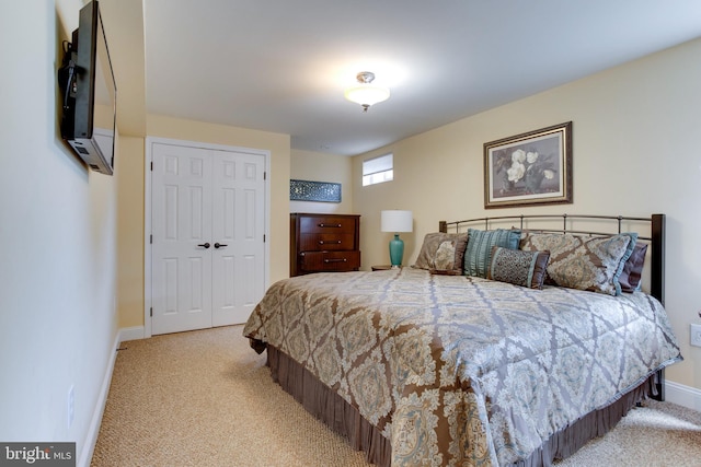 carpeted bedroom with a closet