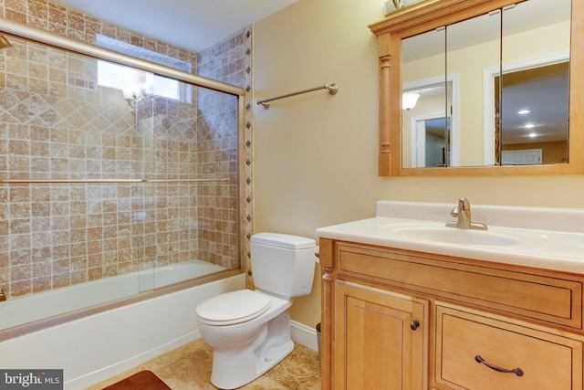 full bathroom featuring tile flooring, shower / bath combination with glass door, toilet, and vanity