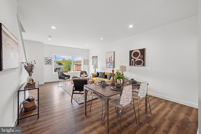 dining space with dark wood-type flooring