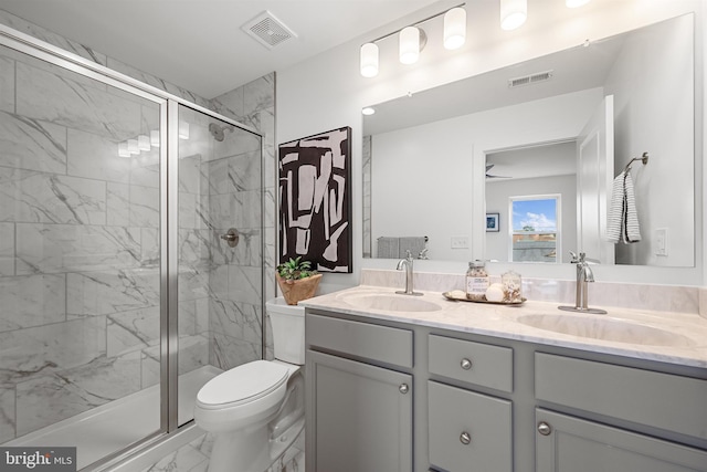 bathroom with walk in shower, tile floors, double vanity, and toilet