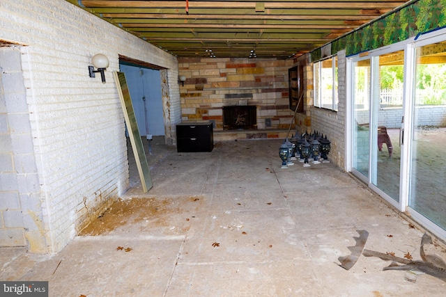 view of patio / terrace with an outdoor stone fireplace