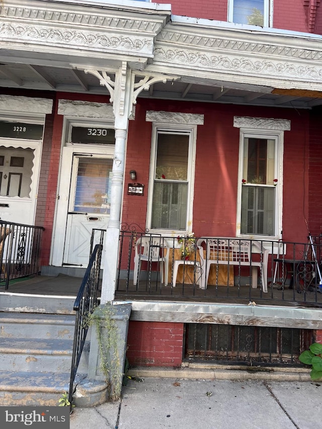 entrance to property with a porch