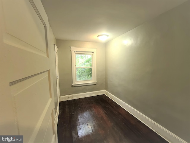 unfurnished room featuring hardwood / wood-style flooring