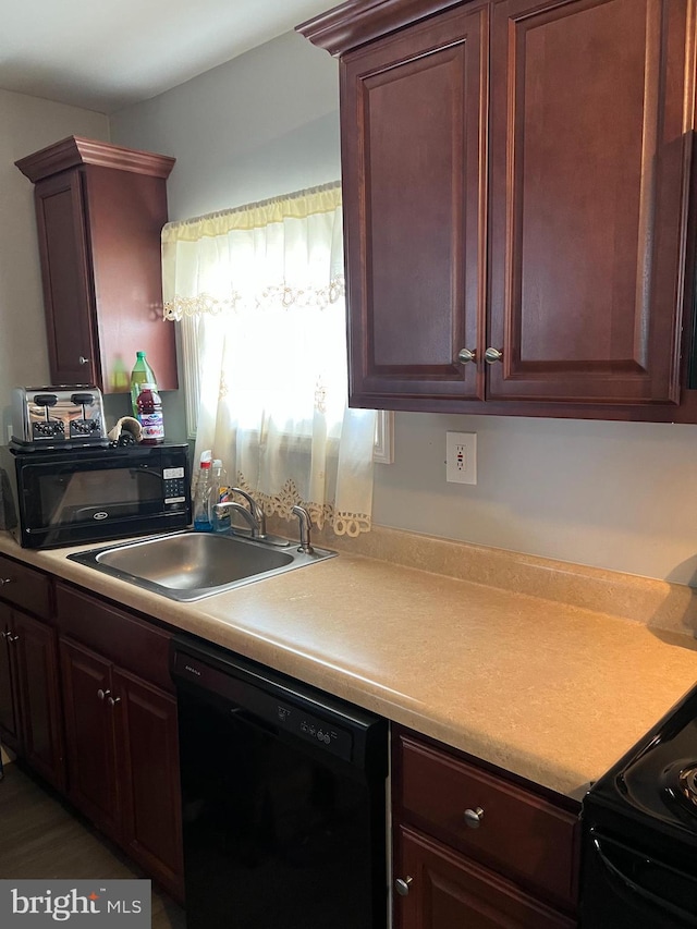 kitchen with sink and black appliances