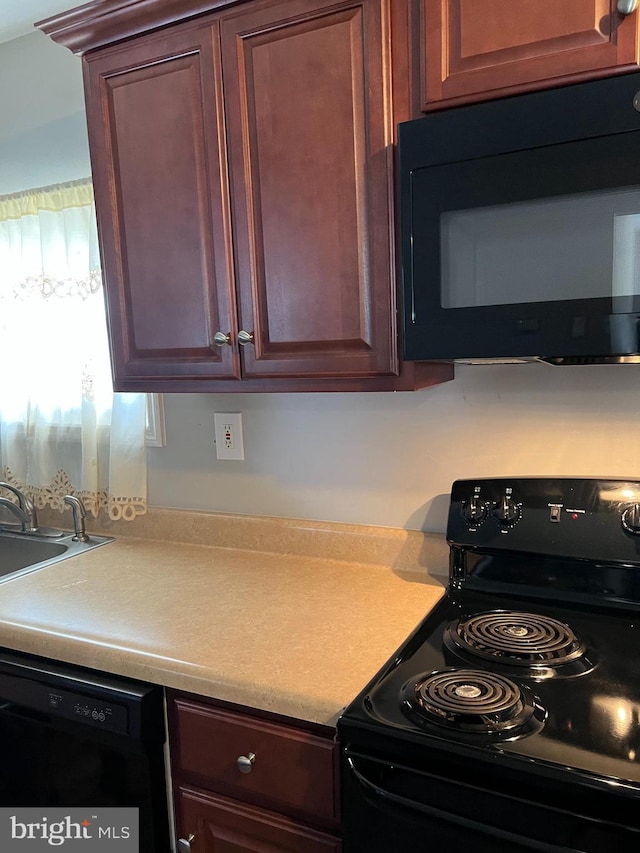 kitchen featuring sink and black appliances