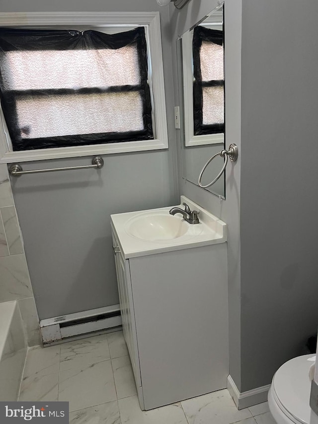 bathroom featuring toilet, tile floors, and vanity