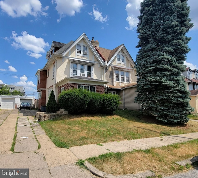 view of front facade with a front lawn and a garage