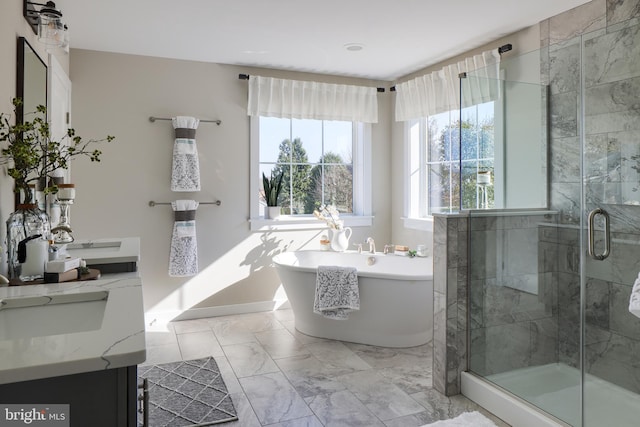 bathroom with large vanity, tile floors, and independent shower and bath