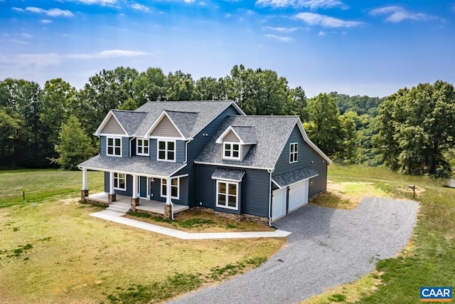 view of front facade featuring a front yard and a garage