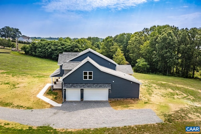 view of front of property with a front yard and a garage