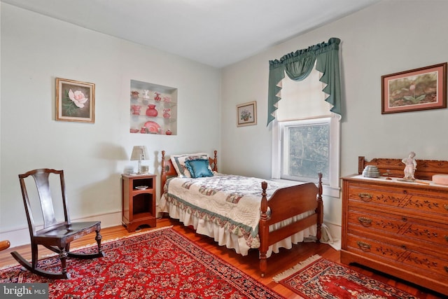 bedroom featuring hardwood / wood-style floors