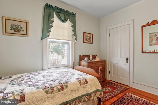 bedroom featuring hardwood / wood-style flooring