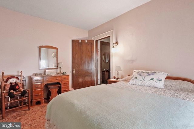 bedroom featuring light colored carpet