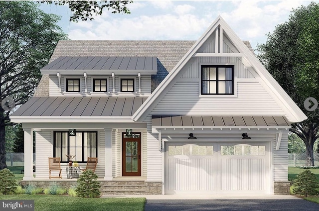 modern farmhouse with metal roof, a garage, a standing seam roof, board and batten siding, and a porch