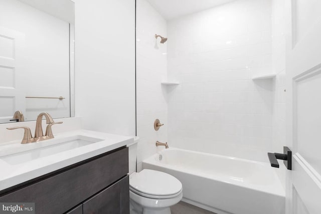 full bathroom with tiled shower / bath combo, toilet, and vanity