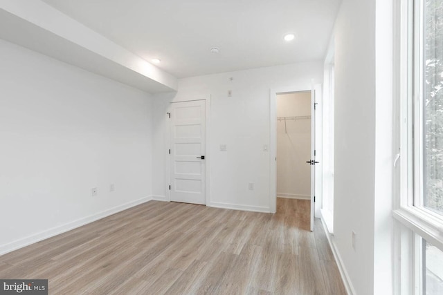 spare room with light hardwood / wood-style flooring