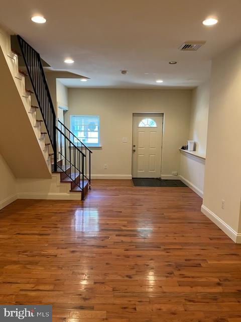 entrance foyer featuring hardwood / wood-style flooring