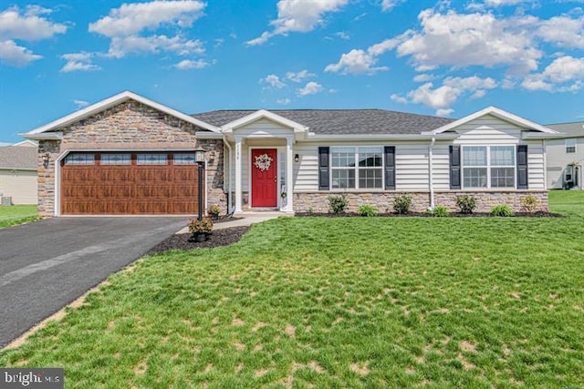 ranch-style house with a front lawn and a garage