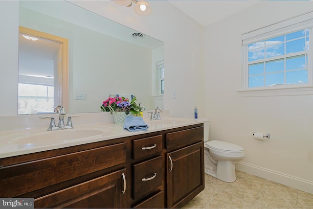 bathroom with vanity and toilet