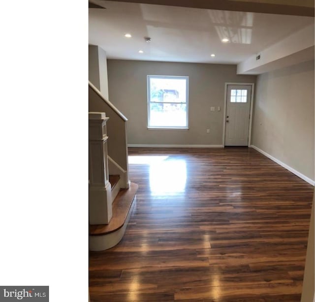 interior space with dark hardwood / wood-style floors