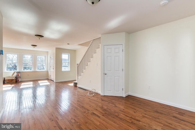 empty room with dark hardwood / wood-style floors