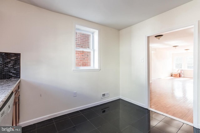 interior space with plenty of natural light and dark hardwood / wood-style floors