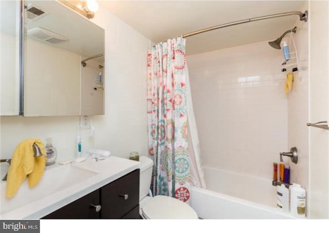 full bathroom with toilet, oversized vanity, and shower / tub combo with curtain