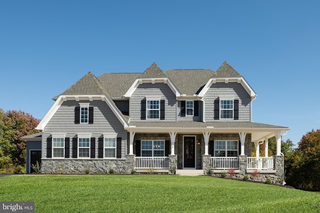 view of front of home featuring a front lawn and a porch