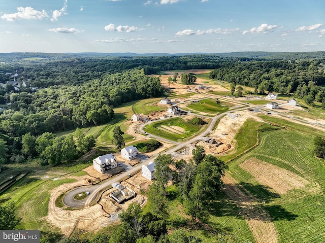 birds eye view of property with a rural view