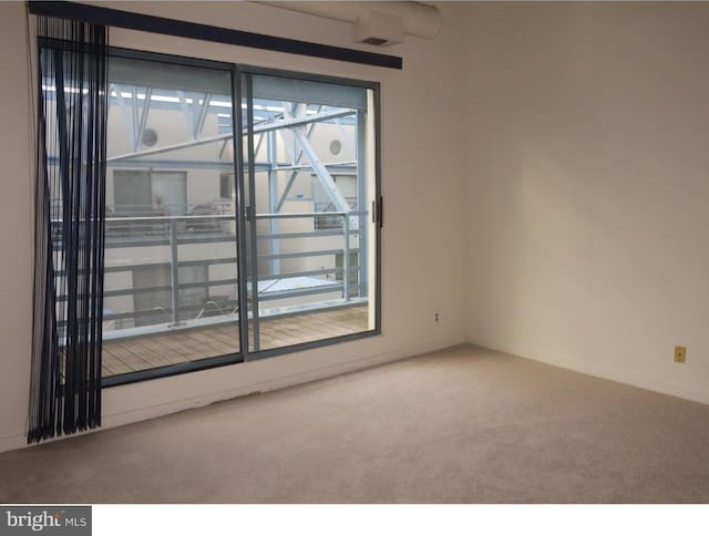 unfurnished room featuring carpet flooring