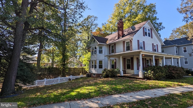 310 Riverview Ave, Florence, NJ 08518 - view of front facade featuring covered porch, a front lawn, and central air condition unit