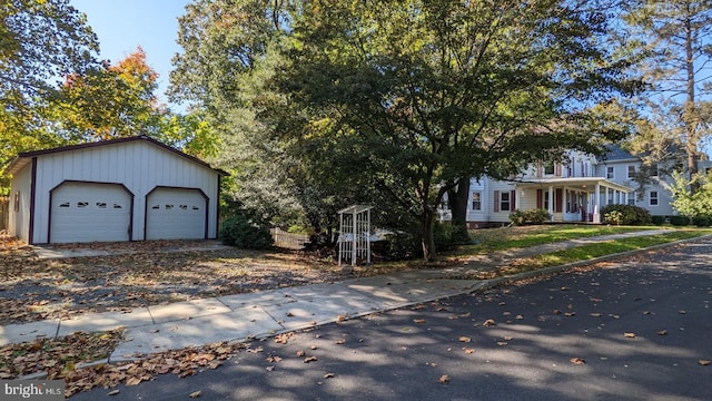 view of front facade with a porch and a garage