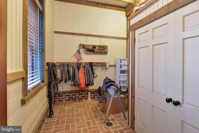 interior space featuring wooden walls