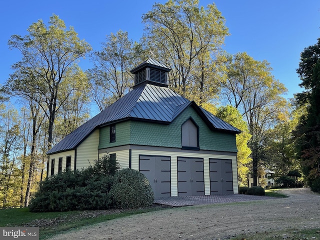 view of property exterior with a garage