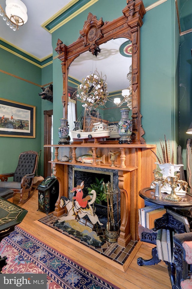 interior space featuring hardwood / wood-style flooring and ornamental molding