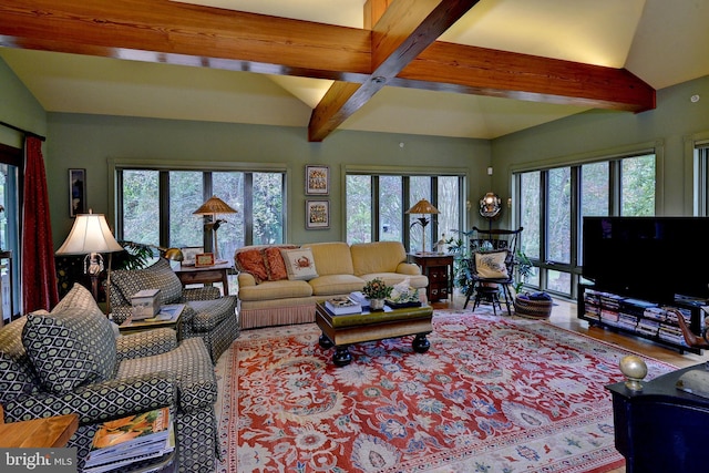 living room featuring beamed ceiling