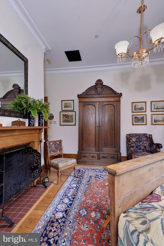 tiled bedroom featuring ornamental molding and an inviting chandelier