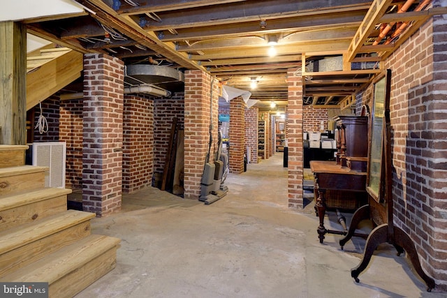 basement with brick wall