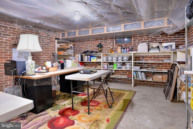 interior space featuring brick wall