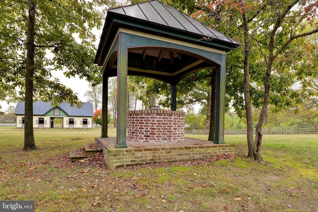 exterior space with a gazebo and a yard