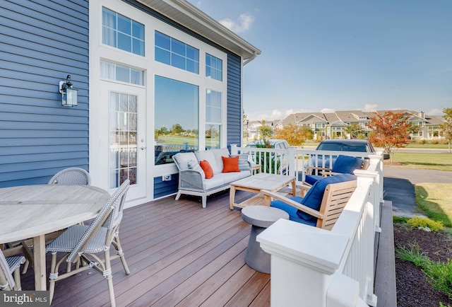 wooden terrace featuring outdoor lounge area